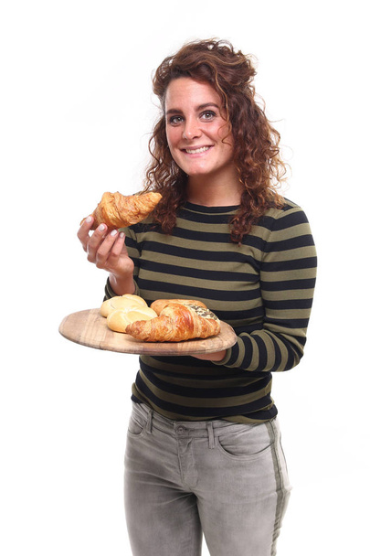 Beautiful caucasian girl holding wooden board with sweet cakes - Fotoğraf, Görsel