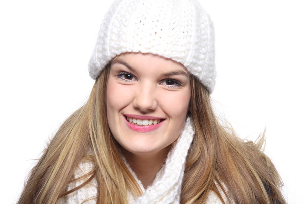 Young beautiful girl in winter clothes is smiling - Fotó, kép