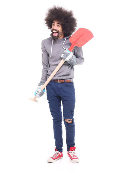 Black man holding shovel on white background - Фото, зображення