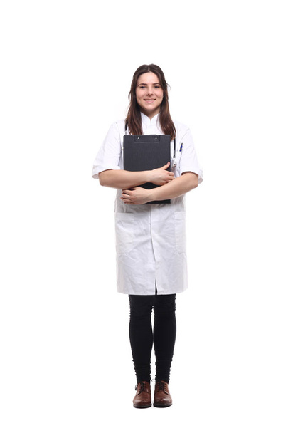 Caucasian female doctor in medical uniform with stethoscope and clipboard - Photo, Image