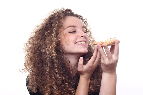 Beautiful caucasian girl is eating pizza - Foto, Imagen