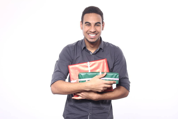Black man with holiday gifts - Foto, imagen
