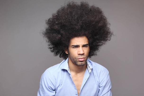 Thinking black man on white background - Valokuva, kuva