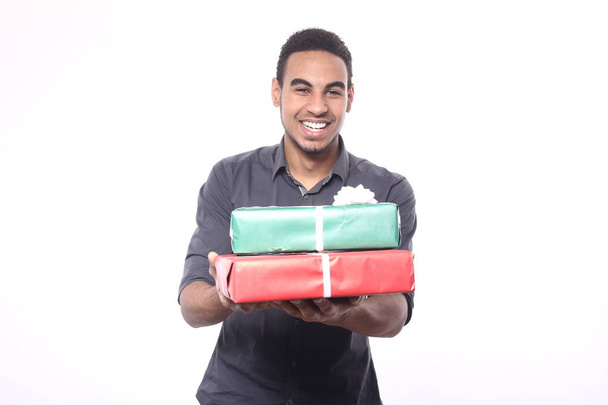 Black man with holiday gifts - Фото, зображення