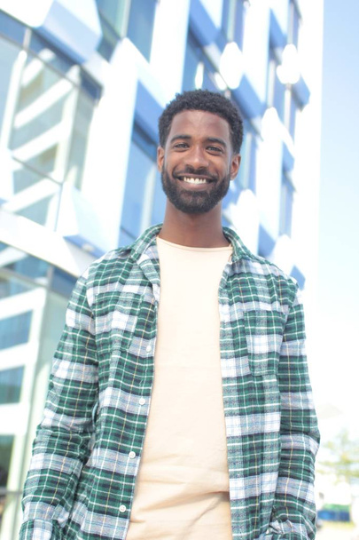 Smiling black man outdoors - Photo, image