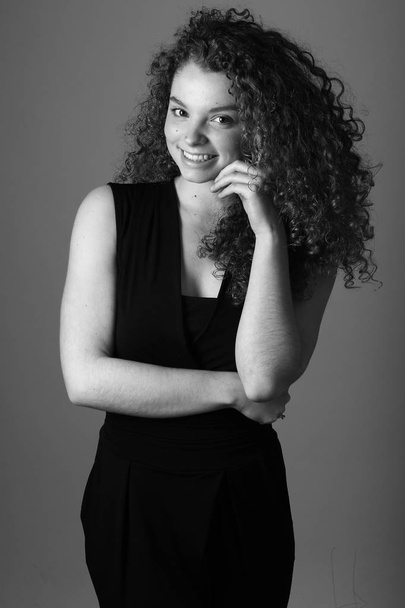 Beautiful caucasian woman is smiling on black and white tone - Zdjęcie, obraz
