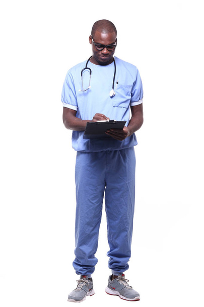 Black doctor in uniform with stethoscope and folder - Fotografie, Obrázek
