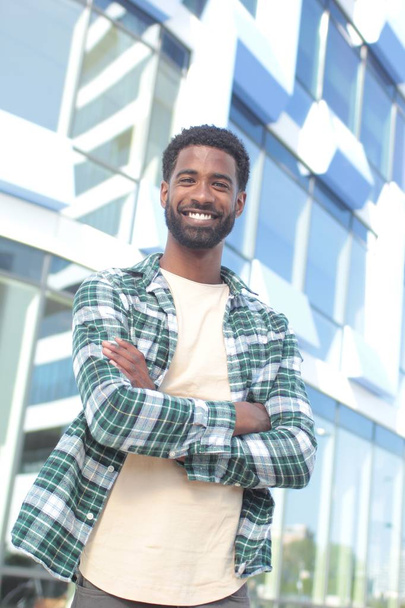 Smiling black man outdoors - Photo, image
