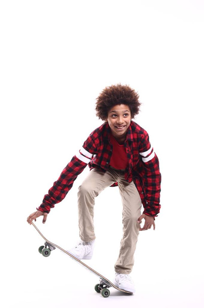Little black boy with skateboard - Foto, Bild
