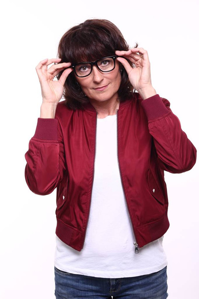 Beautiful adult woman in glasses on white background - 写真・画像