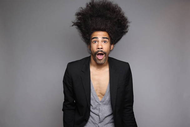 Surprised black man with big hair - Foto, Imagem