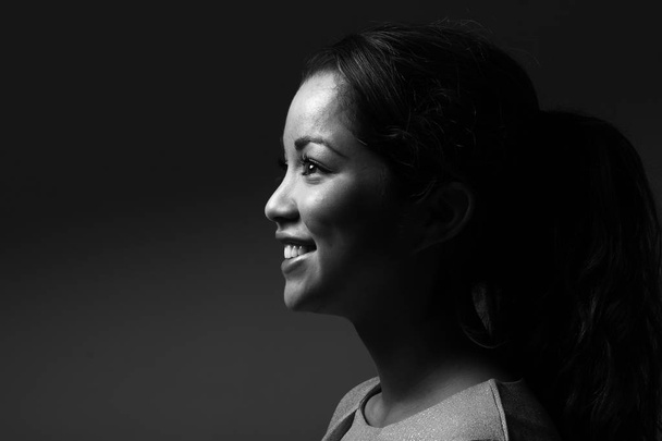 Beautiful caucasian woman is smiling on black and white tone - Photo, image