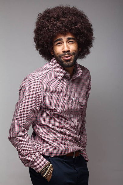 Happy black man with big hair - Фото, изображение