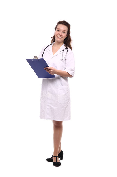 Caucasian female doctor in medical uniform with stethoscope and clipboard - Fotoğraf, Görsel