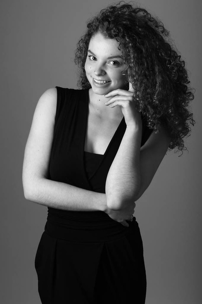 Beautiful caucasian woman is smiling on black and white tone - Fotó, kép