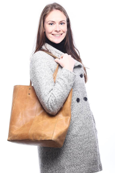 Beautiful caucasian girl with bag - Фото, изображение
