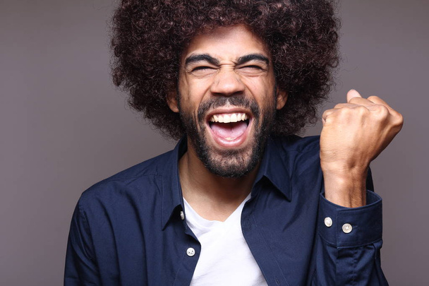 Screaming black man with big hair  - Photo, image