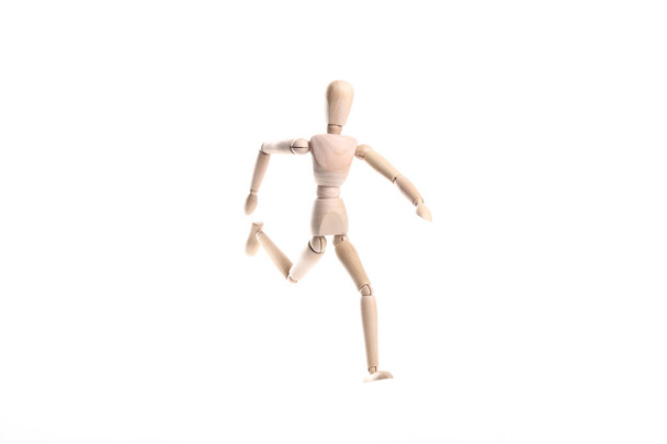 Wooden human toy mannequin on white background - Foto, imagen