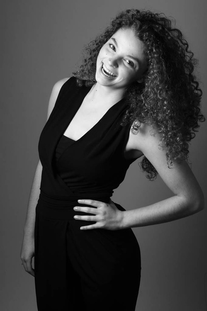 Beautiful caucasian woman is smiling on black and white tone - Zdjęcie, obraz