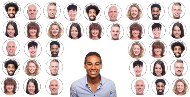 Afro-american man is smiling on background of icons with people faces - Photo, Image