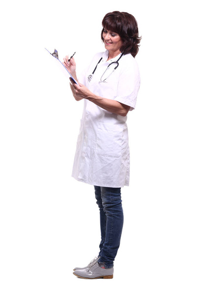 Happy female doctor writing information about a something - 写真・画像