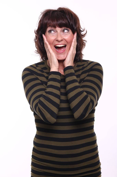 Surprised adult woman on white background - Photo, image