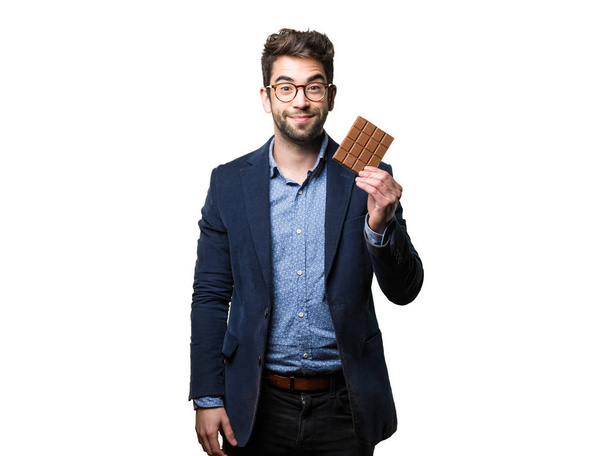 fiatal ember, aki csokit elszigetelt fehér background - Fotó, kép