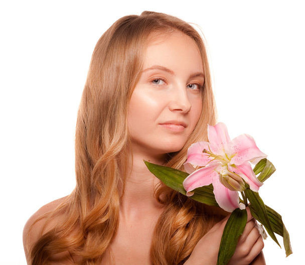 Beautiful girl with a flower lily - Фото, зображення