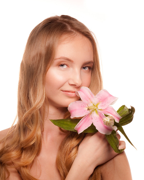 Beautiful girl with a flower lily - Fotoğraf, Görsel