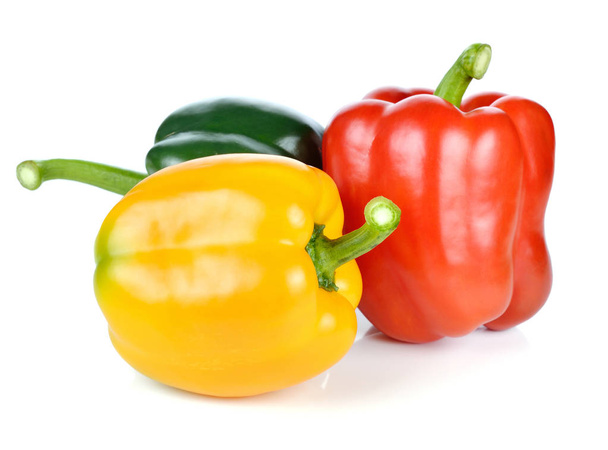 colored peppers over white background - Foto, afbeelding