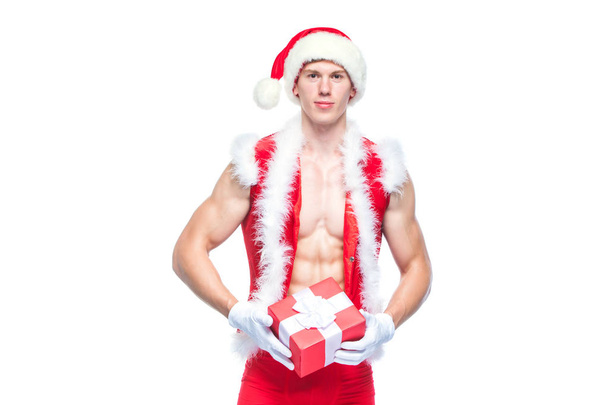 Santa Claus. Fitness Santa Claus isolated on white background. Sexy fitness santa claus. Muscular Santa Claus with giftboxes - Foto, Bild