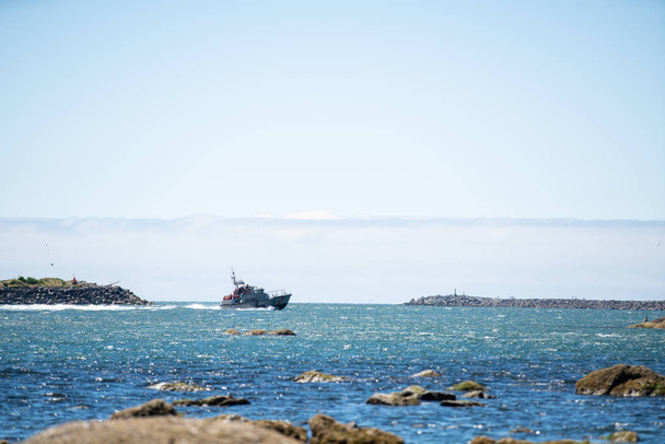 Tillamook, OR / USA - June 23 2018: U.S. Coast guard ship giving tours to torusits in Tillamook bay. - Photo, Image