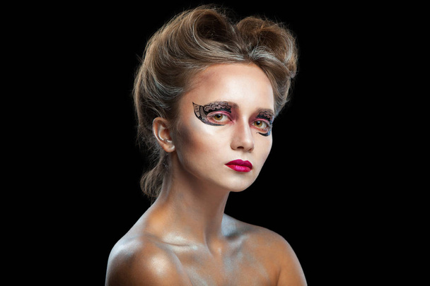 Halloween. Portrait of young beautiful girl with make-up. Isolated on black background. - Фото, зображення