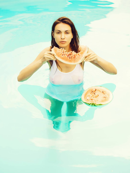 sexy woman with watermelon in pool - Fotografie, Obrázek