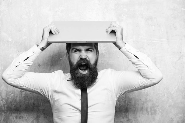 man or hipster with long beard hold laptop - Photo, Image