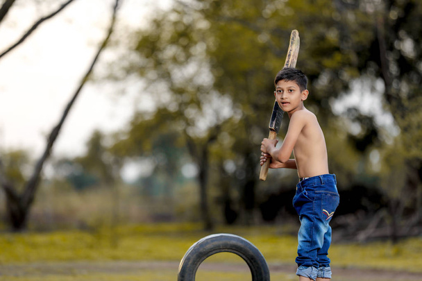 Rural Indian Child Playing Cricket - Photo, Image