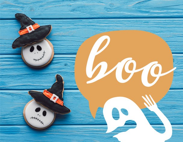 elevated view of delicious homemade halloween cookies on wooden background with ghost and "boo" lettering - Zdjęcie, obraz
