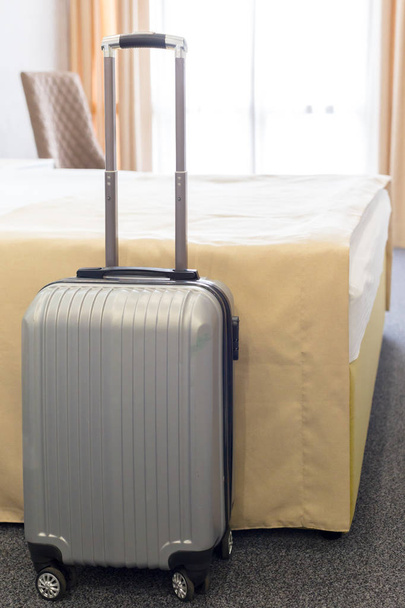 Suitcase or luggage bag in a modern hotel room - Fotoğraf, Görsel
