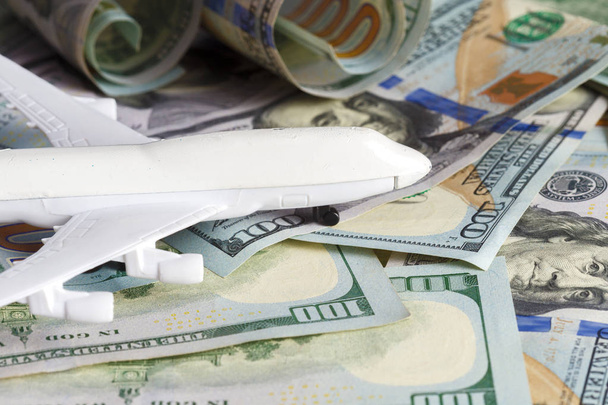 close up of toy airplane on the money banknotes - Φωτογραφία, εικόνα