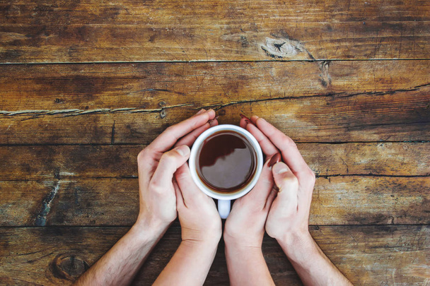 A cup of tea in the hands. Selective focus. Drink. - Photo, Image
