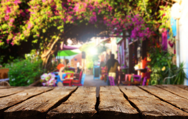 Wooden table with blurred street background - Photo, Image