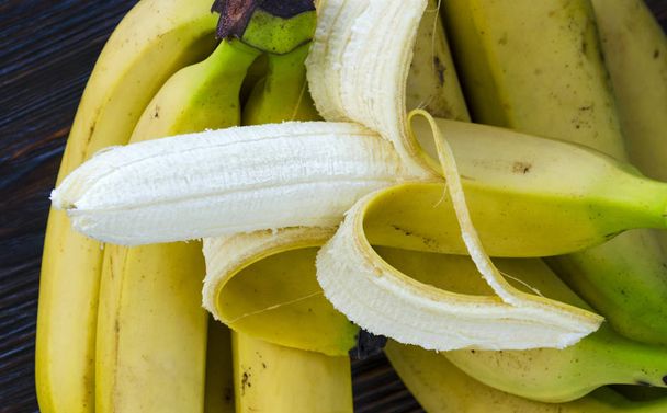 bunch of bananas close-up on a table - 写真・画像