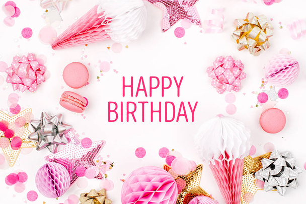 pink and golden confetti, bows, paper decorations and happy birthday lettering on white background - Fotoğraf, Görsel