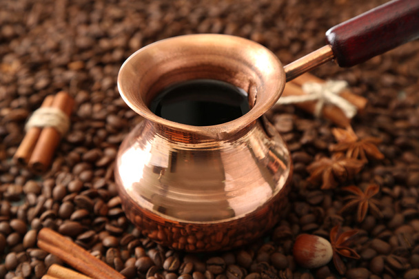 Pot of coffee on coffee beans background - Fotó, kép