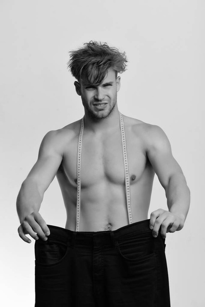 Athlete with messy hair and half naked torso. Fashion concept - Фото, зображення