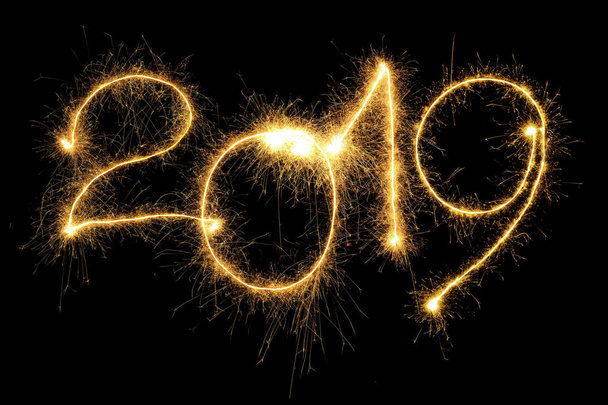 New Year 2019 formed from sparking digits over black background - Photo, Image