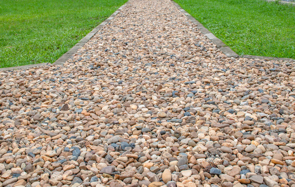 Walkway paved with gravel beside a green lawn. - Photo, Image