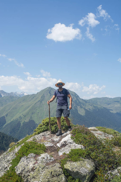 Lonely man practicing hiking in high mountains in summer. - Photo, image