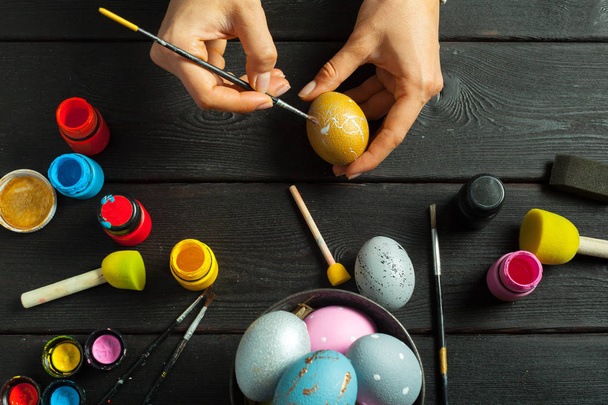 person hands painting eggs for Easter - Fotó, kép