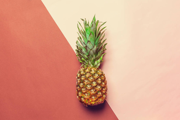 pineapple on red and pink colored paper - Foto, immagini